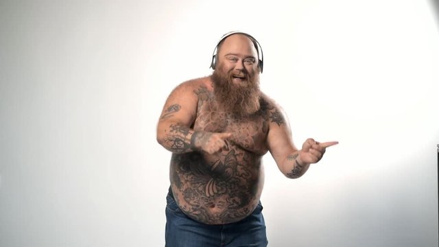 Man dancing while listening to music