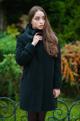 Beautiful young  woman wearing fur autumn coat