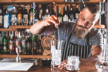 Barman is making cocktail