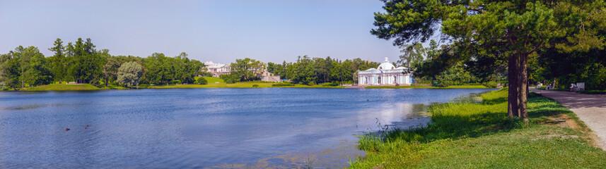Fototapeta na wymiar Landscape panorama overlooking the Great Pond and architectural landmarks in the Catherine Park in Tsarskoe Selo (Pushkin)
