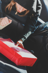 Burglar thief stealing smartphone and bag from car