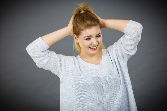 Unhappy woman screaming and yelling in pain