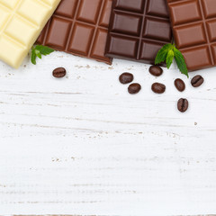 Naklejka na ściany i meble Schokolade Tafel Süßigkeiten Essen Textfreiraum Quadrat Holzbrett von oben