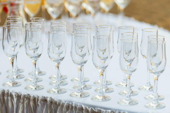 Glasses in a row at a buffet table