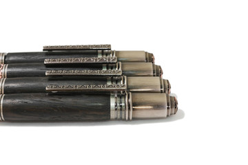 Ballpoint pen made of wood and metal on a white background