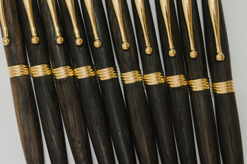 Ballpoint pen made of wood and metal on a white background