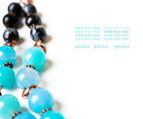 jewerly with chalcedony and obsidian around white background