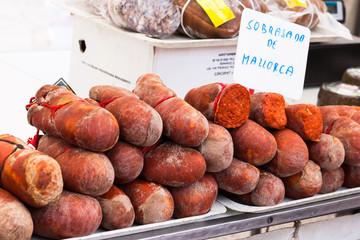 Traditional Majorcan Sobrassada sausage (Sobrasada de Mallorca) for sale in the stall of Sineu market, Mallorca, Spain
