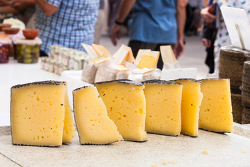Manchego cheese for sale in the stall of Sineu market, Majarca, Spain