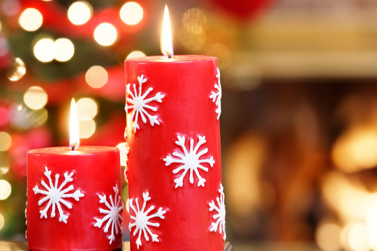 Christmas candles by the tree and iving room fire