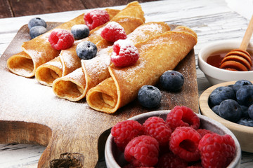 Delicious Tasty Homemade crepes or pancakes with raspberries and blueberries