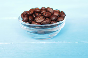 coffee beans in a cup on a blue background