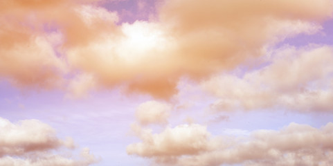 Pastel coloured romantic sky with white clouds