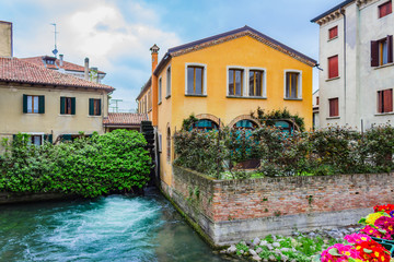 The northern Italian town of Treviso in the province of Veneto, it is located close to Treviso, Padua and, Vicenza. View of the city of Treviso Italy. Venetian architecture in Treviso, Italy.