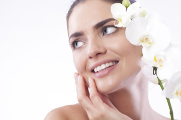 Beautiful fresh woman with orchid.