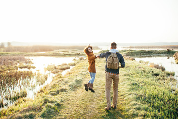 Young tourist couple at sunset sun