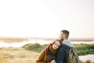 Young tourist couple at sunset sun