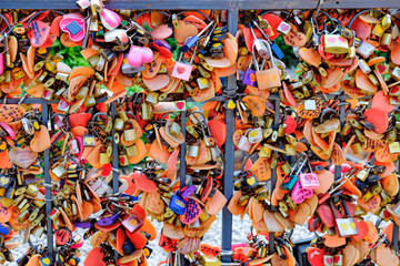 Fototapeta na wymiar Juliet Love Garden with its many Love padlocks in Asiatique The Riverfront. Locks of love symbolize love which will be locked forever. Selective focus