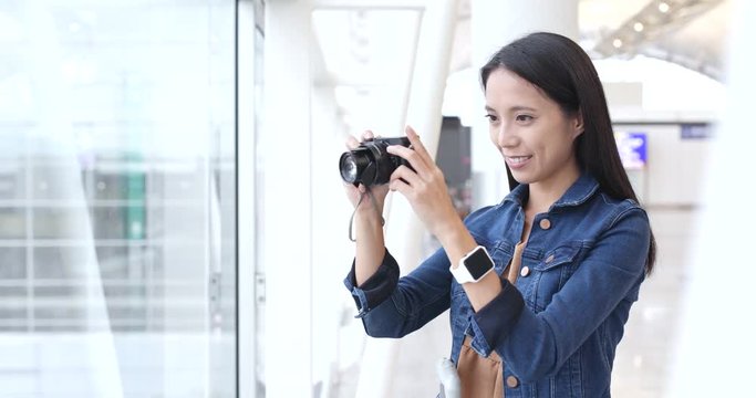 Traveler woman taking photo with camera