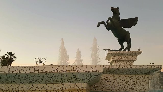 Beautiful fountain with pegasus statue on it in Corinth in Greece.