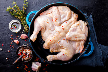 Whole Raw Chicken with Herbs and Spices on a Frying Pan Food Ingredient Cooking Background Bird Meat