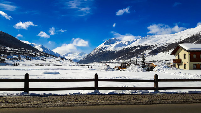 Winter holiday in the Akps mountains under blue sky