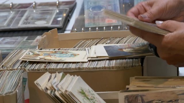 Searching for a collection of old postcards.