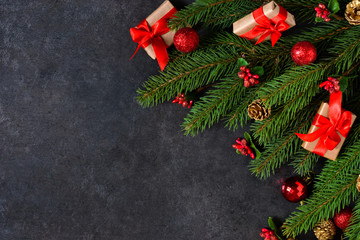 The New Year card is decorated with fir, boxes, ribbons and snow on a black background. Happy New Year and Merry Christmas!