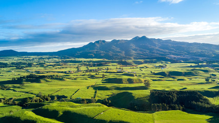 Aerial view on a farmland with stock paddocks at the foot of Mount Taranaki. Taranaki region, New Zealand