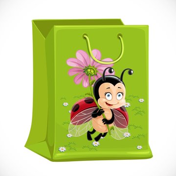 Green gift bag with a picture of Ladybug isolated on white background