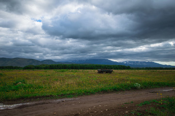 Fototapeta na wymiar Kamchatka. Green fields and volcanoes. Wild nature