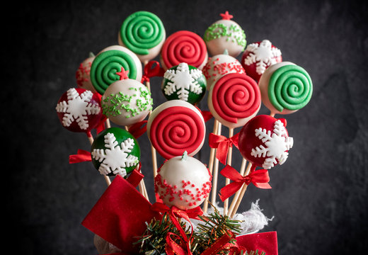 Christmas decoration on the cake pops on dark background,selective focus