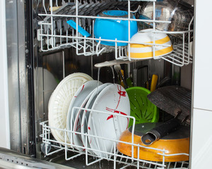 Dirty dishes loaded in a dishwasher