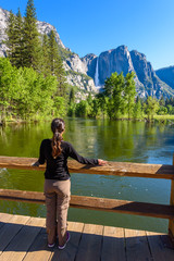 Yosemite National Park - Reflection in Merced River of Yosemite waterfall and beautiful mountain...