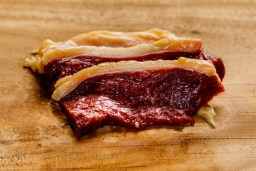 Raw fresh pork meat on cutting board on wooden table