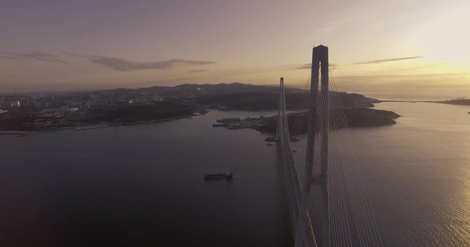Flying above the road and between cables of cable-stayed Russian bridge