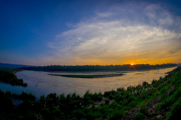Beautiful sunset in Chitwan National Park, is mainly covered by jungle, fish eye effect