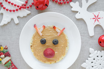 Christmas reindeer on peanut butter rice corn crackers snacks, fun festive food art for kids