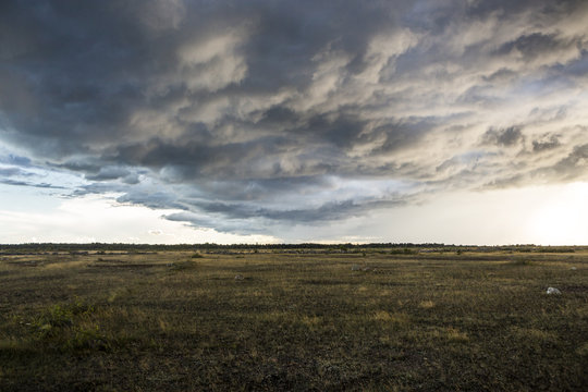 Dark storm clouds over drt field