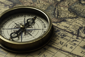 Fototapeta na wymiar Retro compass with old map