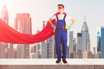 Janitor In Superhero Costume Standing On Top Of Building