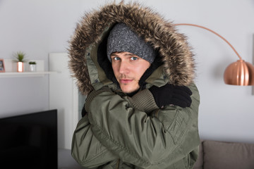 Man With Warm Clothing Feeling The Cold