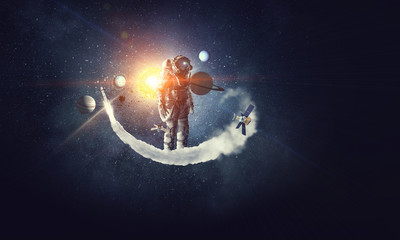 Fototapeta na wymiar Astronaut surfing dark sky. Mixed media