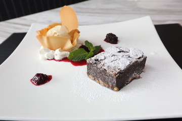 Chocolate Brownie with ice cream and blueberry sauce topping, American Style Luxury Restaurant