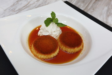 Caramel custard pudding with mint leave, American Style Luxury Restaurant