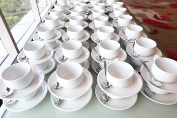 Group of empty coffee cups.Many rows of white cup for service tea or coffee in breakfast or buffet and seminar event. white cup in Catering and Cocktail.