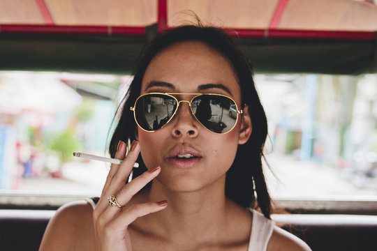 Girl smoking in Tuk Tuk