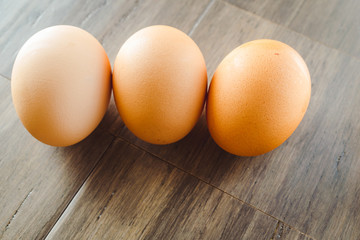 Brown Eggs on a Wooden Bamboo Background