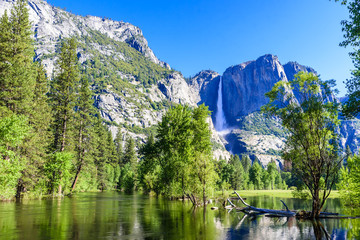 Yosemite National Park - Reflection in Merced River of Yosemite waterfall and beautiful mountain...