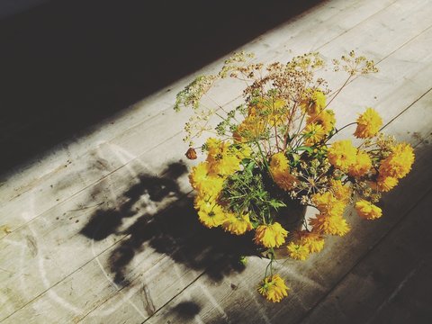Country Flowers Into a Vase On an Old Table